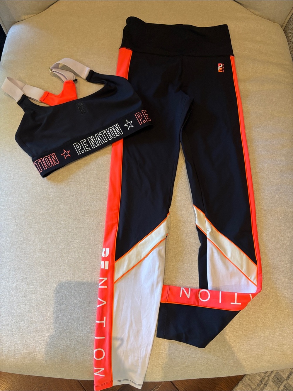 P.E Nation Black and Neon Orange Sports Bra & Leggings Set